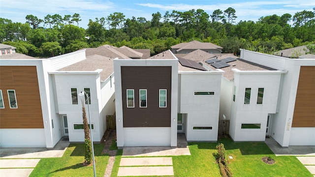 contemporary house with a front yard