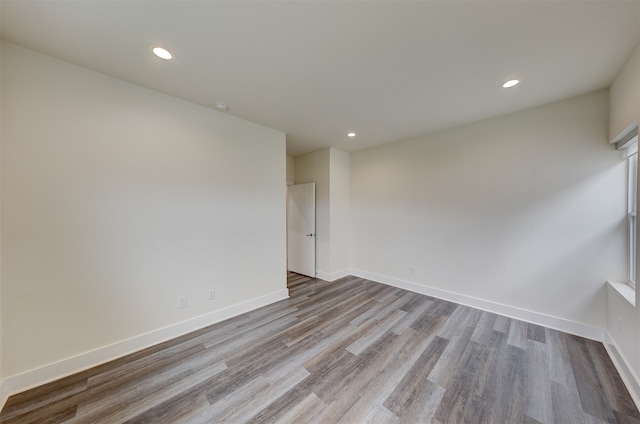 spare room with light hardwood / wood-style floors