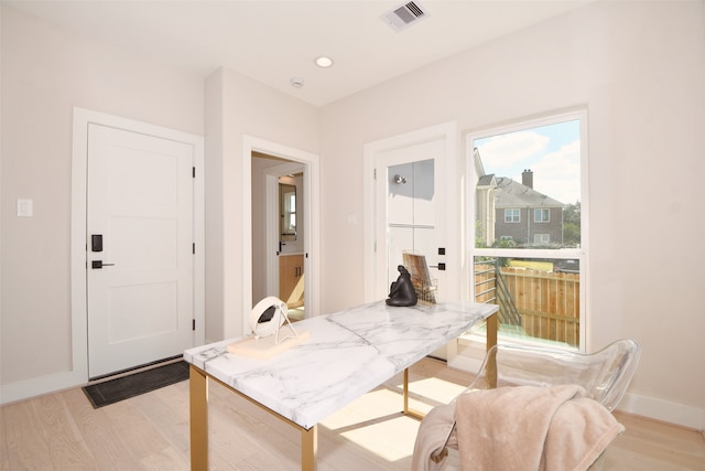 dining space featuring light hardwood / wood-style floors