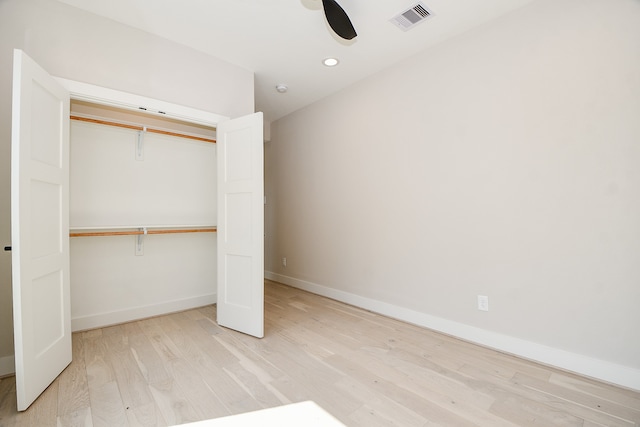 unfurnished bedroom with a closet, ceiling fan, and light hardwood / wood-style floors