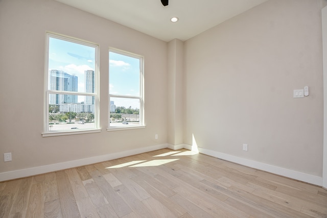 spare room with light wood-type flooring