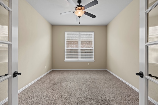 carpeted empty room with ceiling fan