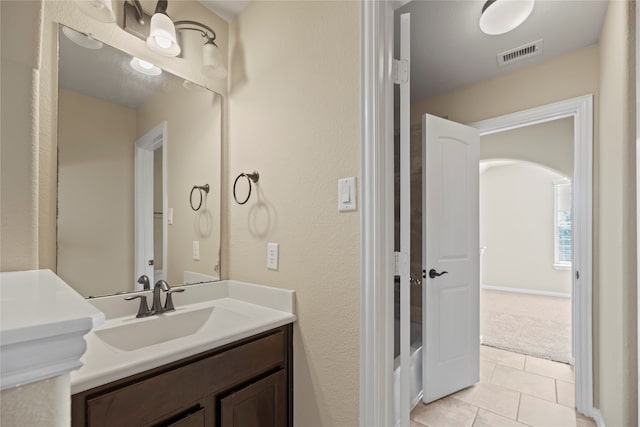 bathroom with vanity and tile patterned flooring