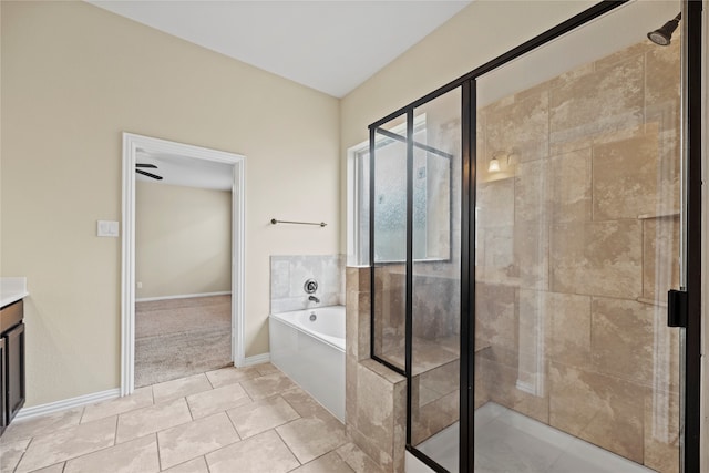 bathroom featuring vanity, shower with separate bathtub, and tile patterned floors