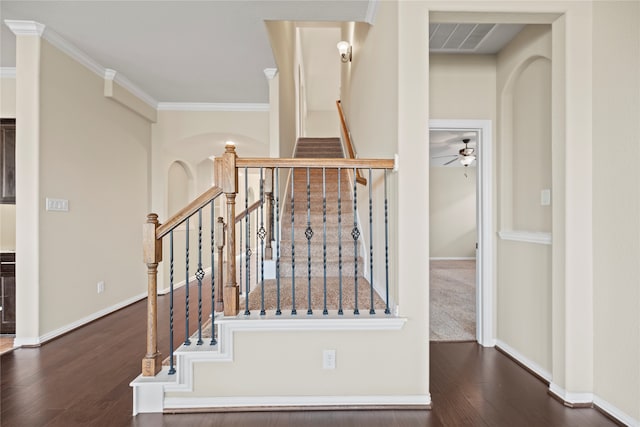 stairway with crown molding, hardwood / wood-style flooring, and ceiling fan