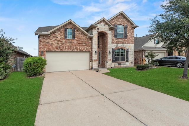 view of front property featuring a front yard and a garage