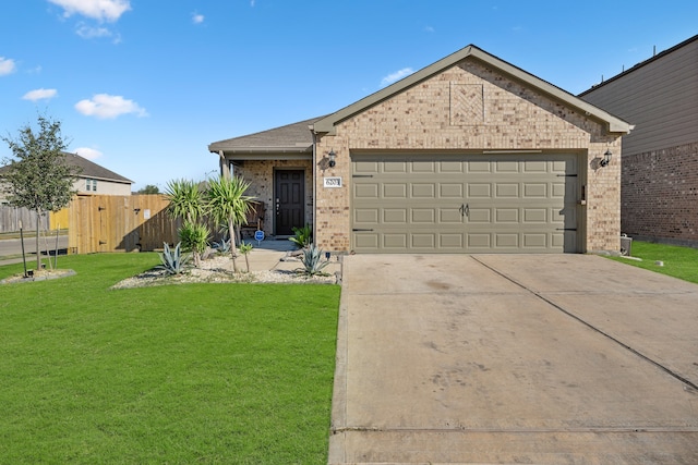 ranch-style home with a garage and a front lawn