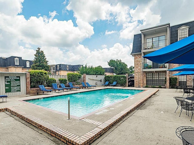 view of pool with a patio area