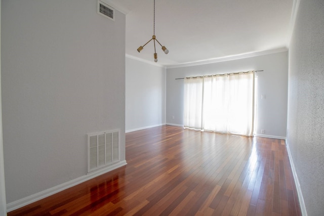 2400 N Braeswood Blvd Unit 314, Houston, TX 77030 - unfurnished room featuring crown molding, wood finished floors, a textured wall, and baseboards