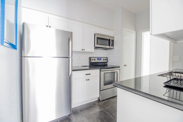 2400 N Braeswood Blvd Unit 314, Houston, TX 77030 - kitchen with appliances with stainless steel finishes, white cabinetry, backsplash, and dark countertops