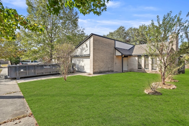 view of home's exterior with a yard and an outdoor kitchen