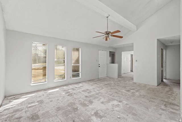 unfurnished living room with ceiling fan, high vaulted ceiling, beamed ceiling, and light colored carpet