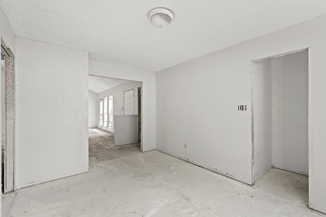 spare room featuring a textured ceiling