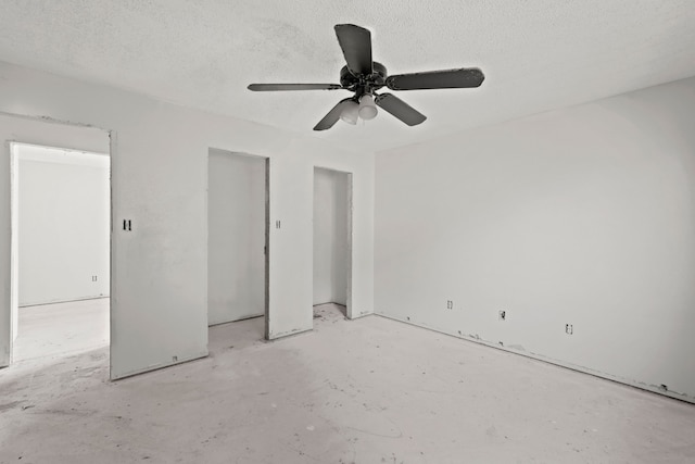 unfurnished bedroom with a textured ceiling and ceiling fan