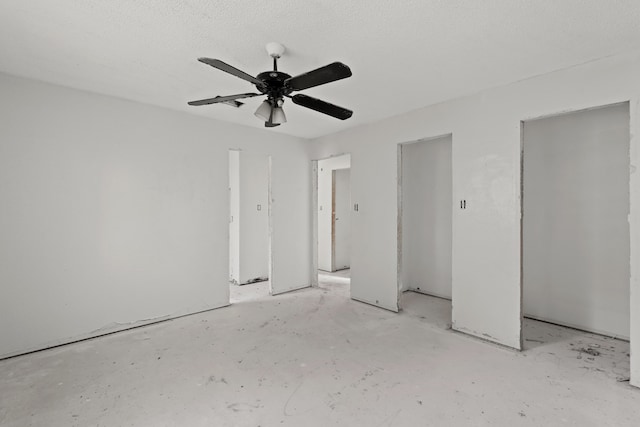 unfurnished bedroom featuring a textured ceiling and ceiling fan