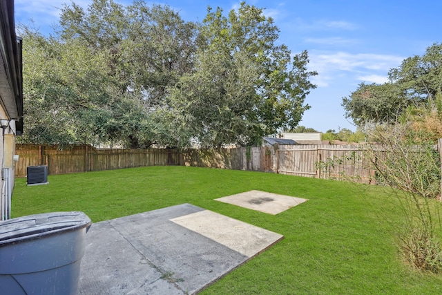 view of yard with a patio and central air condition unit