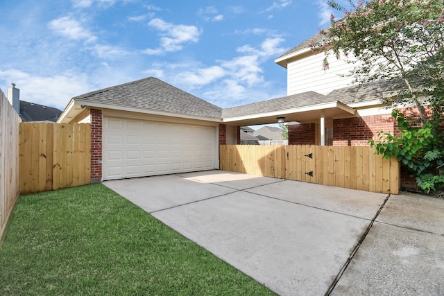 view of front of property with a garage and a front yard