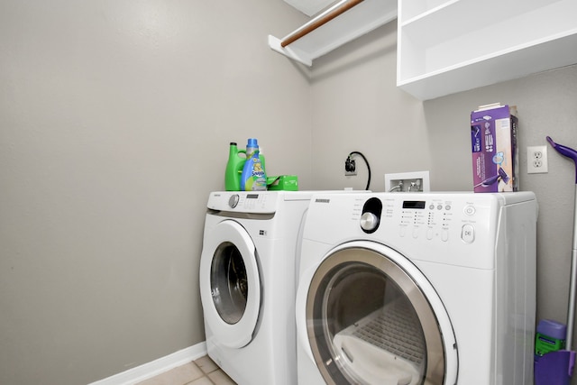 laundry room with light tile patterned floors and independent washer and dryer