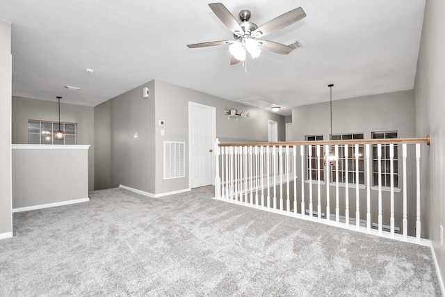 carpeted empty room with ceiling fan