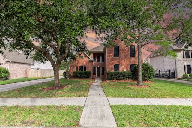 view of front of home with a yard