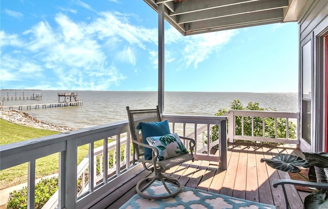 wooden deck featuring a water view