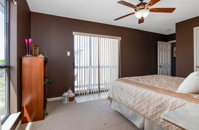 bedroom with multiple windows, carpet flooring, and ceiling fan