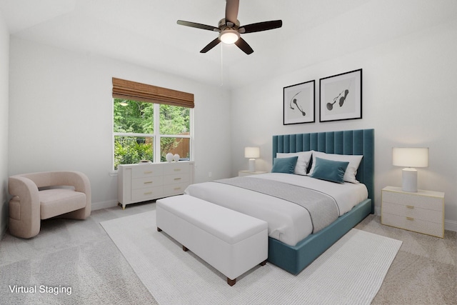 bedroom featuring light carpet and ceiling fan