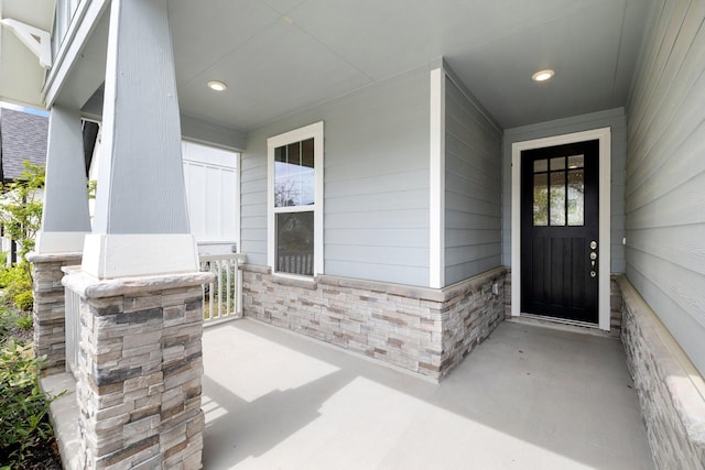 doorway to property featuring a porch