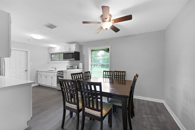 dining room featuring dark hardwood / wood-style floors and ceiling fan