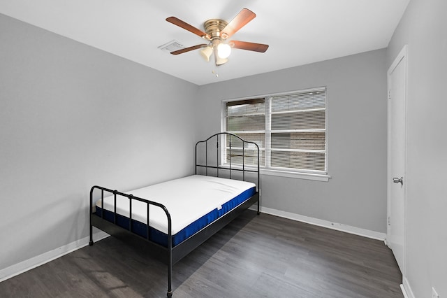 bedroom featuring dark wood-type flooring and ceiling fan