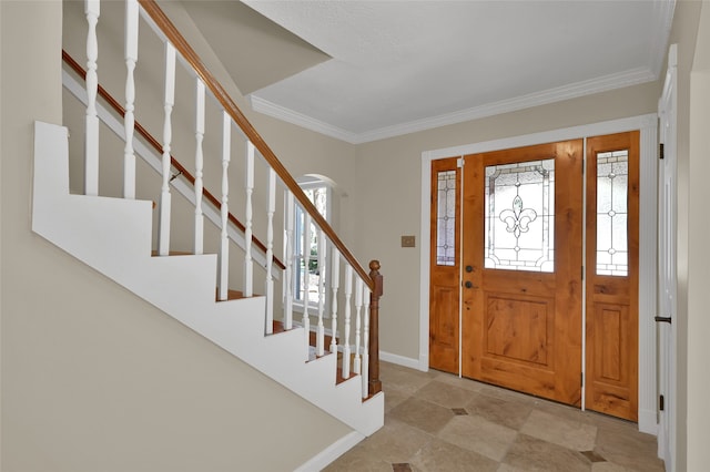 entryway featuring crown molding