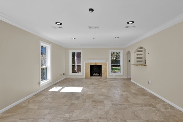 unfurnished living room with ornamental molding and a fireplace