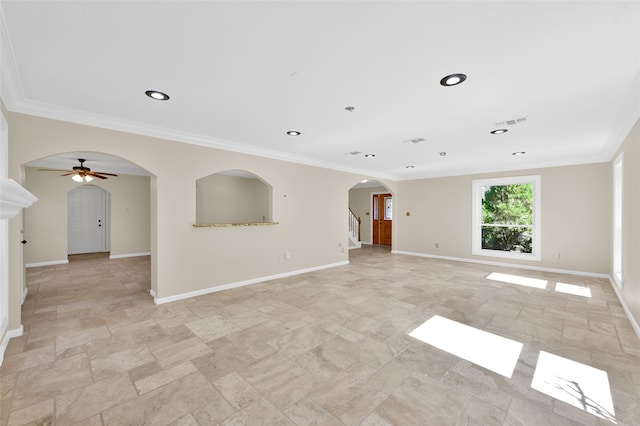 spare room with ceiling fan and ornamental molding