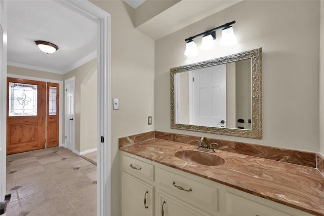 bathroom featuring vanity and ornamental molding