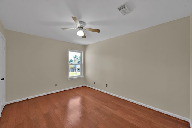 unfurnished room featuring ceiling fan and hardwood / wood-style floors