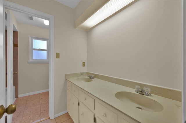 bathroom featuring vanity and tile patterned flooring