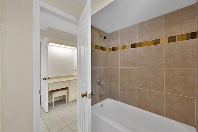 bathroom featuring tiled shower / bath combo and tile patterned flooring