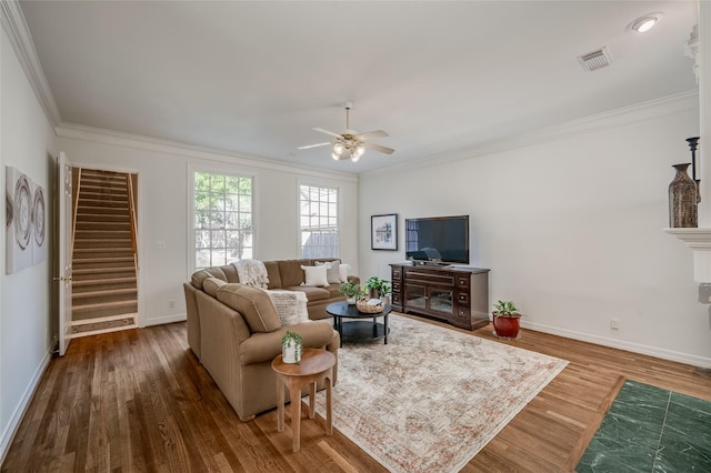 living room featuring ornamental molding, ceiling fan, and hardwood / wood-style flooring