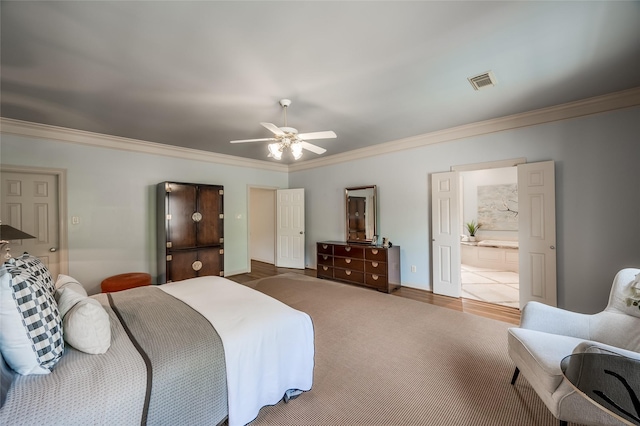 bedroom with connected bathroom, ceiling fan, and crown molding