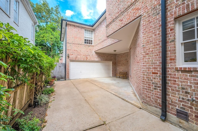 view of property exterior featuring a garage