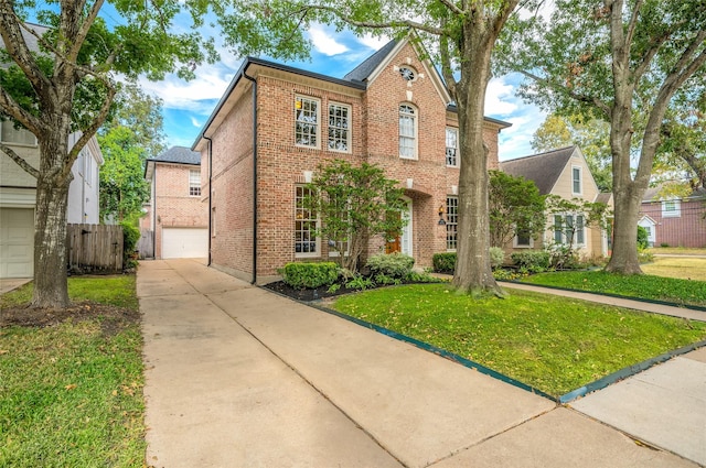 view of front facade featuring a front yard and a garage