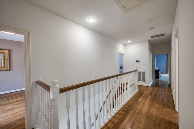 corridor featuring dark wood-type flooring