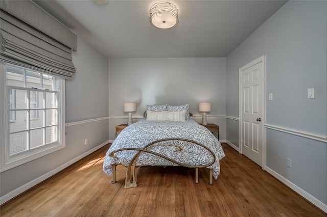 bedroom featuring wood-type flooring