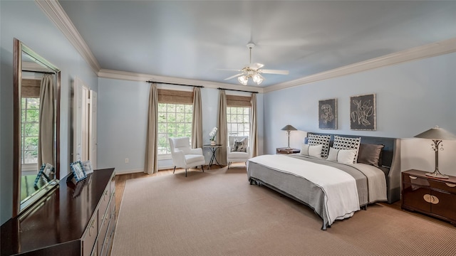 bedroom featuring ceiling fan, crown molding, and light hardwood / wood-style flooring