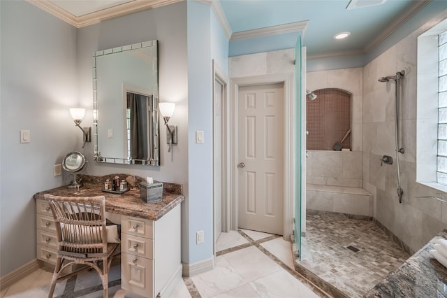 bathroom featuring ornamental molding and tiled shower