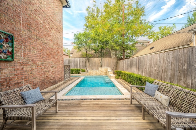 view of pool featuring a wooden deck