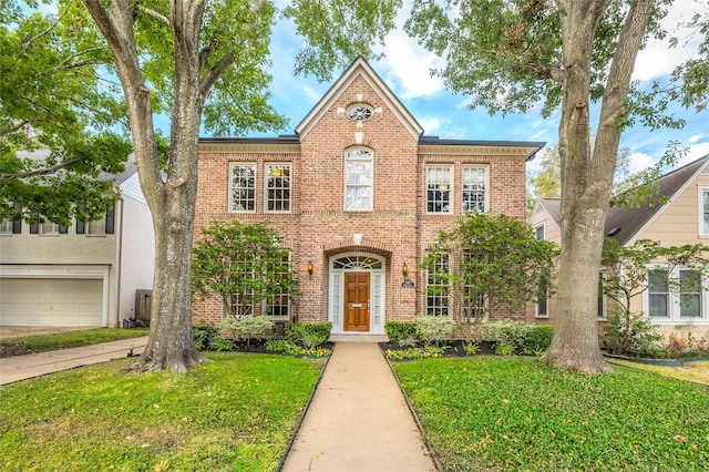 view of front facade featuring a front yard and a garage