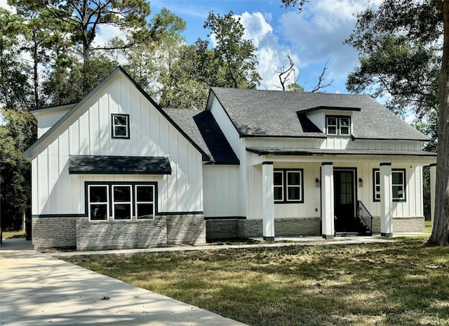 view of front of house with a front lawn and a porch