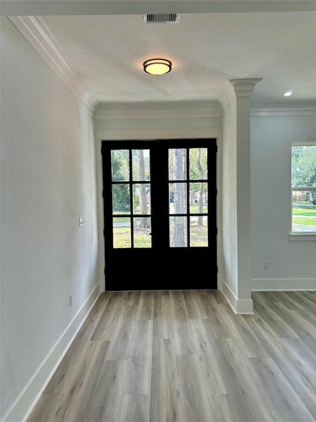 interior space featuring light hardwood / wood-style flooring, french doors, and a healthy amount of sunlight