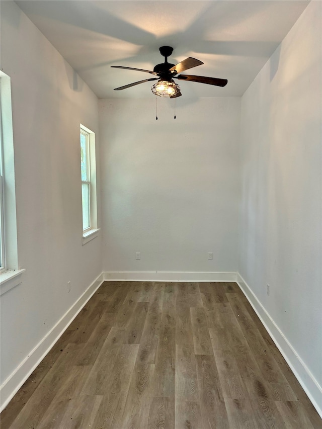 unfurnished room featuring hardwood / wood-style flooring and ceiling fan